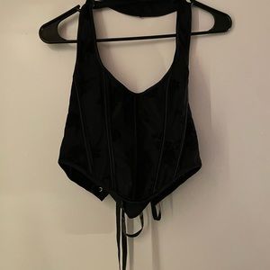 Black halter style corset top. Cute for date night or lingerie.